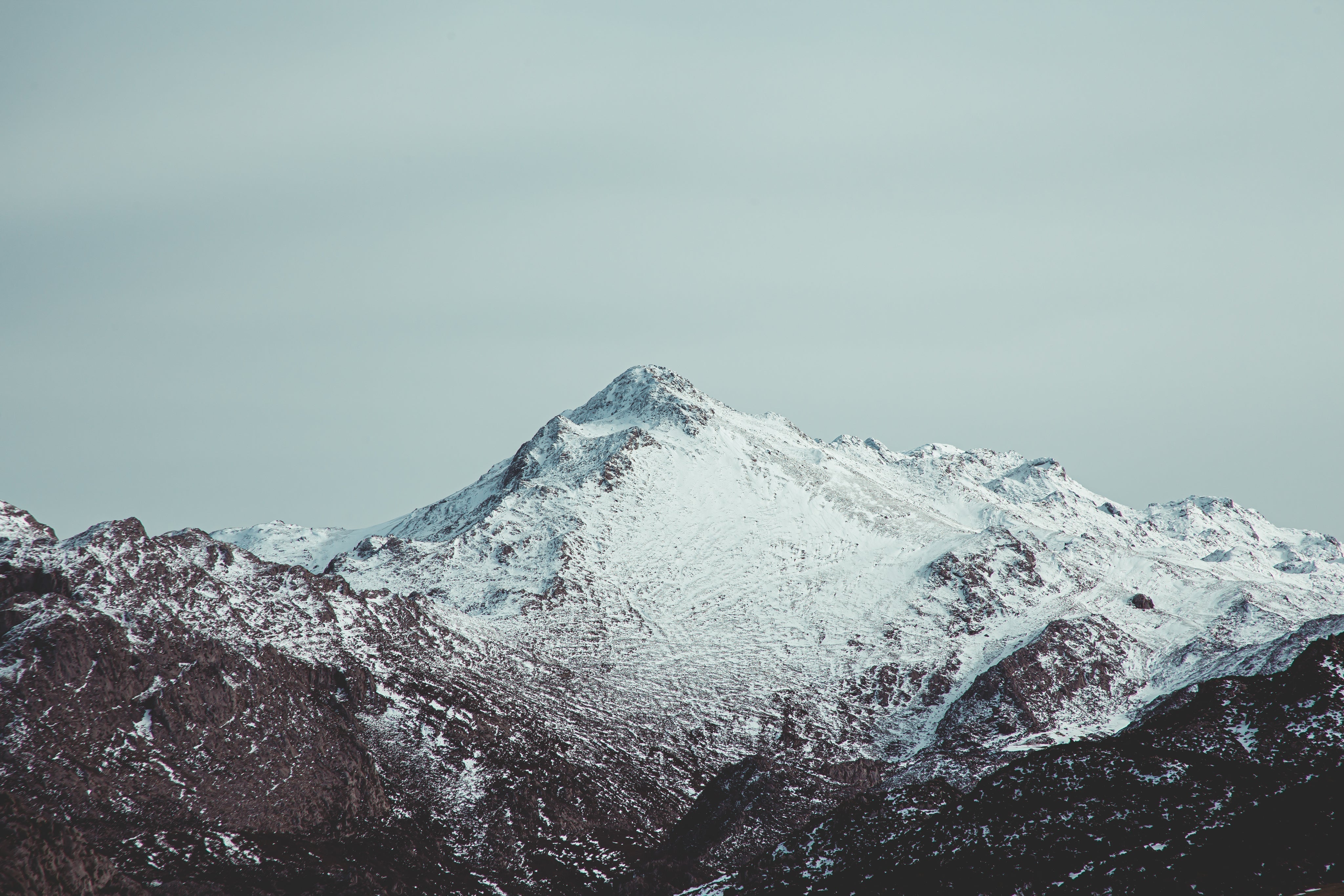Snow-covered mountain peak representing high-altitude origin of Shilajit