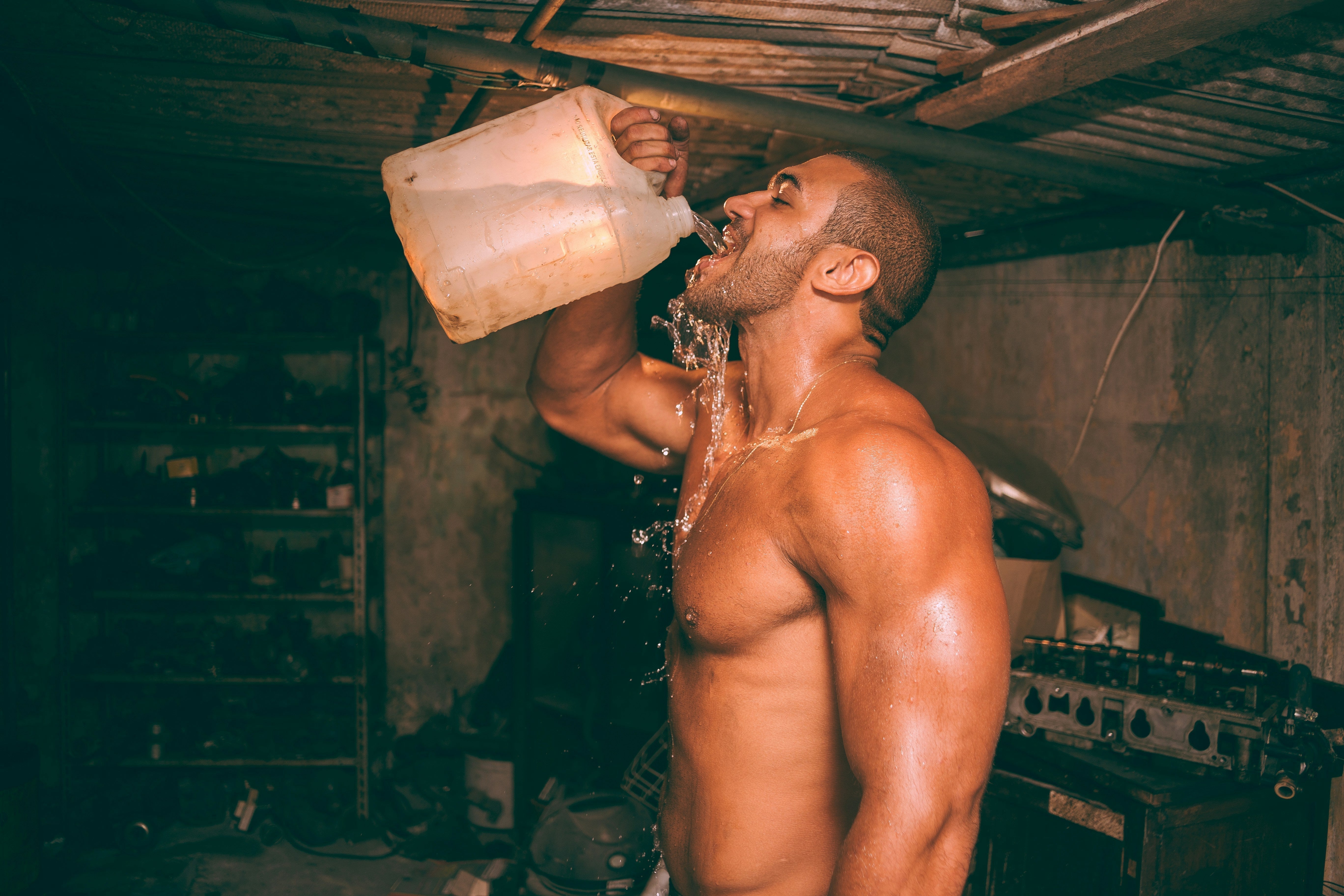 Athlete drinking during training to represent intra-workout hydration and endurance.